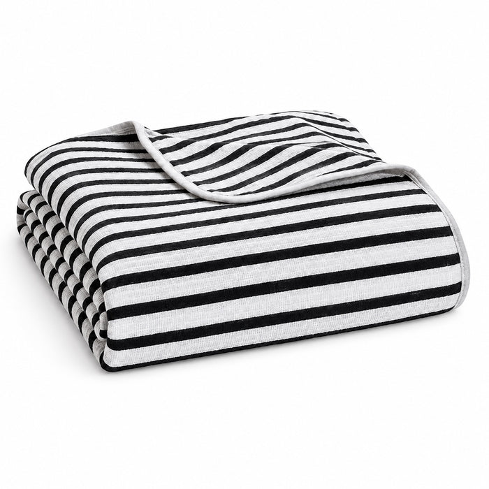Eclectic Aden + Anais black and white striped muslin cotton swaddle blanket folded on a white background.