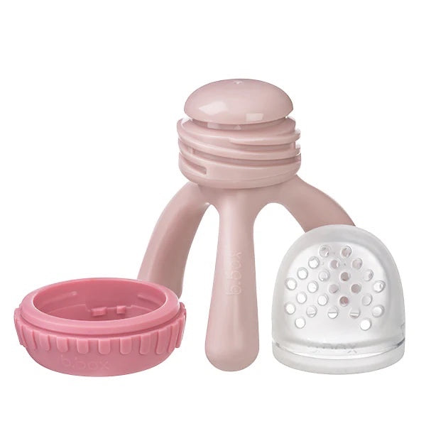 Eclectic B.Box blush silicone fresh food feeder with tripod base, click-lock ring, and clear pouch for baby weaning.