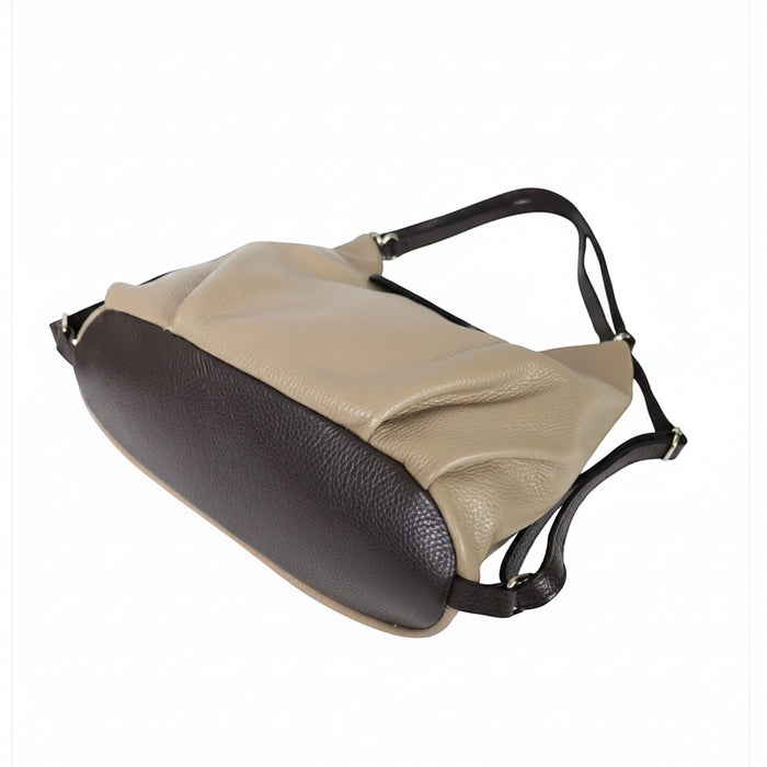 Eclectic Donatello Duo taupe and dark brown grain leather convertible bag with adjustable straps on a white background.