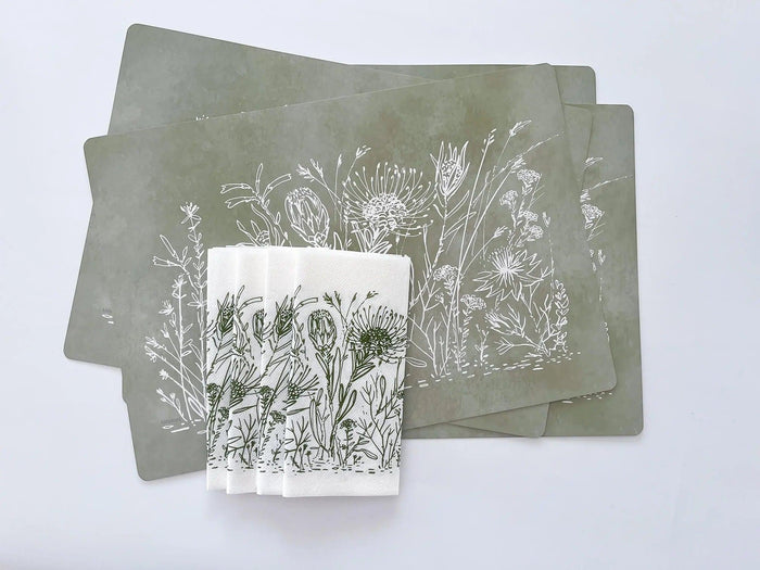 Eclectic Fynbos sage green reusable paperboard placemats with white botanical illustrations in a set of four.