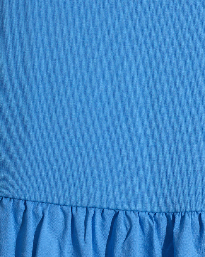 Close-up of the Draper James Lila Mixed Media Midi Dress in Light Blue, showcasing a ribbed cotton bodice and a gathered, ruffled skirt.
