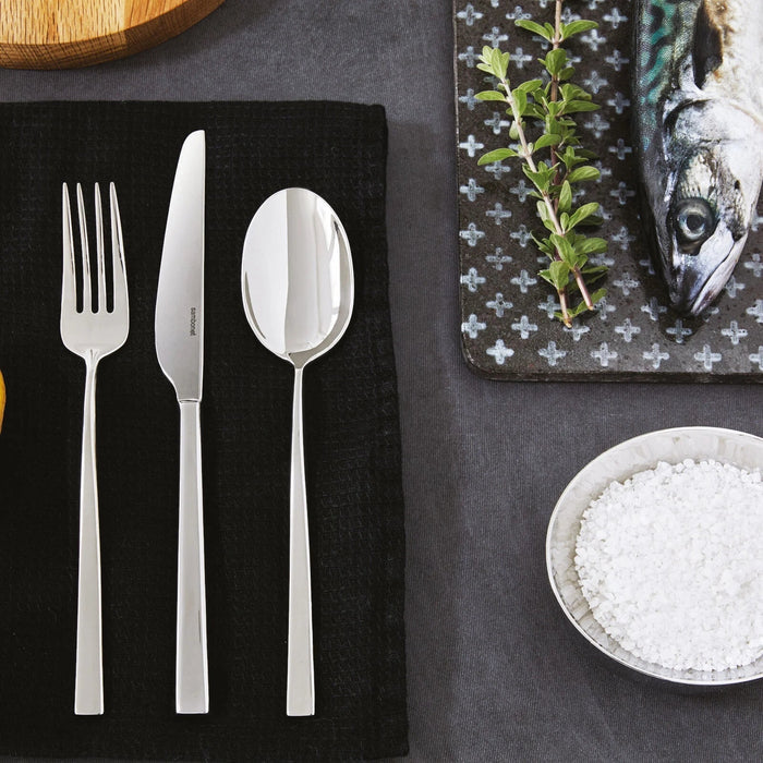Eclectic Sambonet Linea Q stainless steel fork, knife, and spoon set with a mirror-polished square profile design.