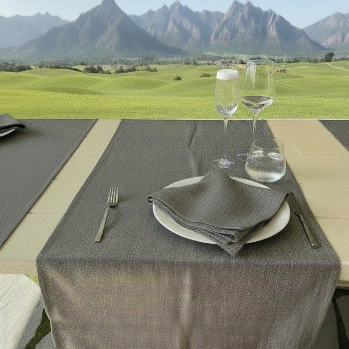 Eclectic ash grey linen-look polyester table runner set on an outdoor dining table with mountain views