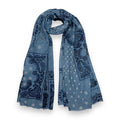 Eclectic denim blue wool blend scarf featuring an oversized navy bandana paisley print and frayed edges.