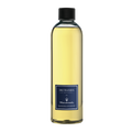 Eclectic Dr Vranjes Maserati diffuser refill bottle with golden fragrance oil and blue label on black background