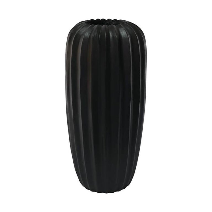 Eclectic 50cm tall matte black fluted fibrestone vase with a sculptural architectural silhouette.