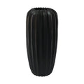 Eclectic 50cm tall matte black fluted fibrestone vase with a sculptural architectural silhouette.
