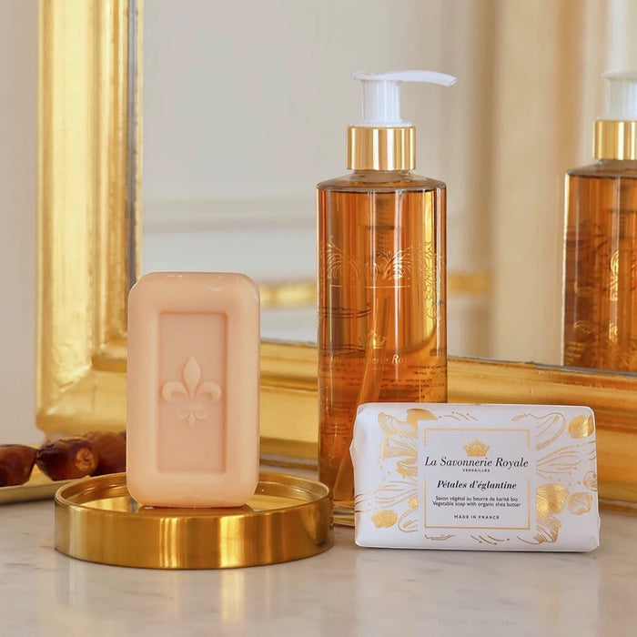 Eclectic La Savonnerie Royale rosehip soap bar with fleur-de-lys embossing, liquid soap, and illustrated packaging.