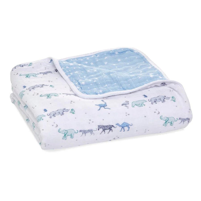 Eclectic Aden + Anais Rising Star four-layer cotton muslin baby blanket with blue and white animal print pattern.