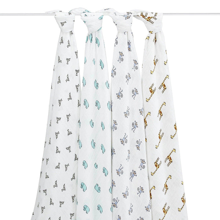 Eclectic Aden + Anais cotton muslin swaddle blankets featuring bird, elephant, monkey, and giraffe animal prints.