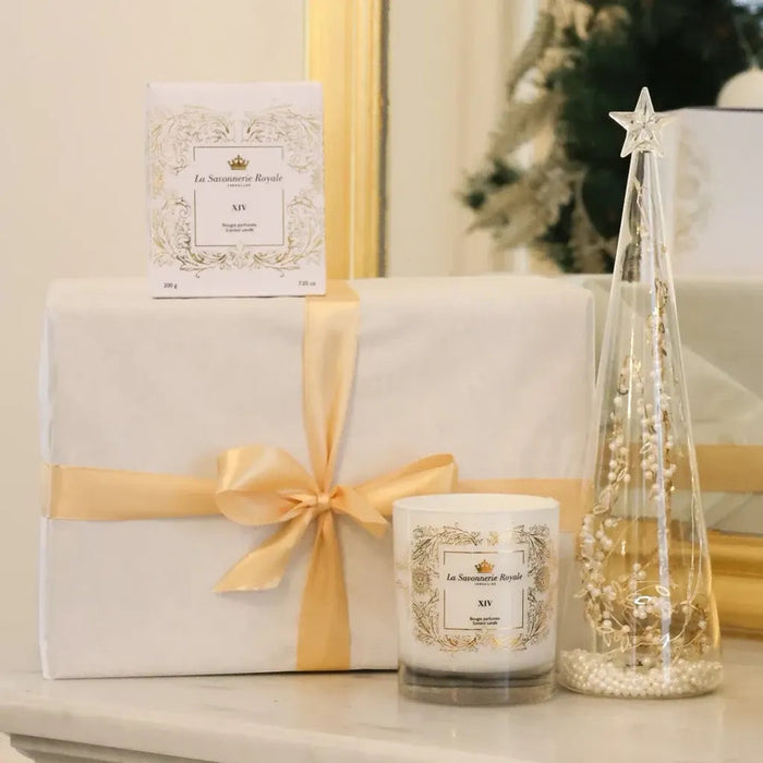 Eclectic La Savonnerie Royale XIV scented candle with gift box and decorative glass tree on a marble surface