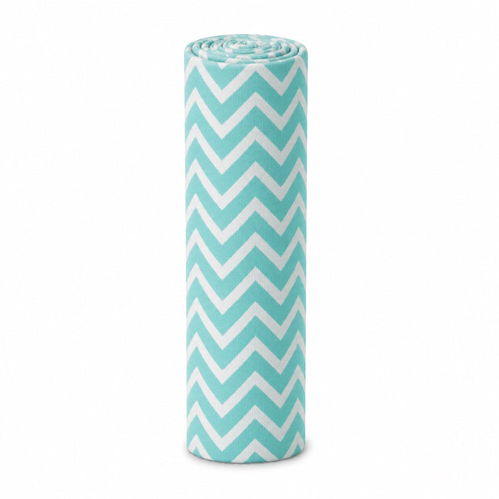 Eclectic Biddykins cotton flannel baby blanket in a turquoise and white chevron pattern, rolled for storage.