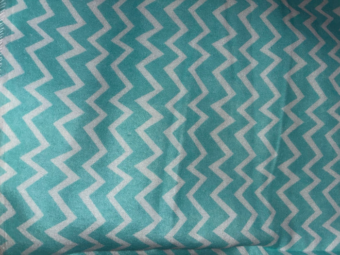 Eclectic Biddykins cotton flannel baby blanket featuring a turquoise and white chevron pattern